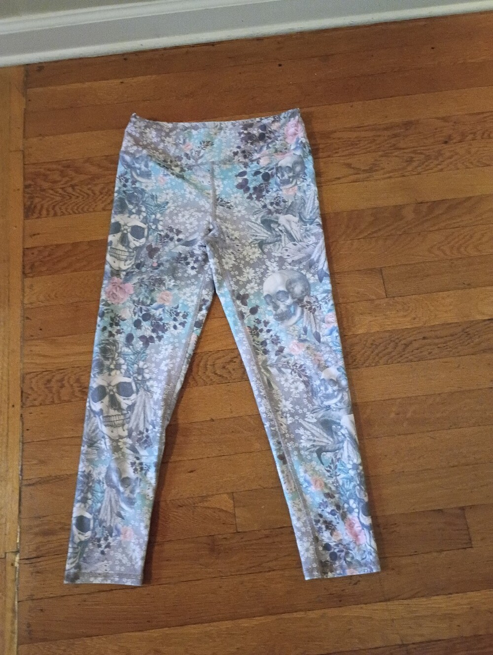colorful flowers and skull design leggings from evolution and creation medium